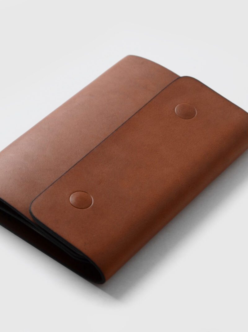 Passport cover with button  •  Copper color